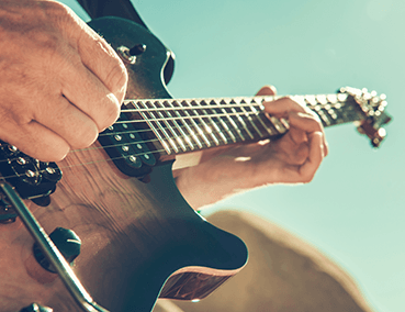 man playing electric guitar