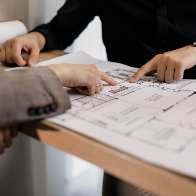 Finger pointing to a map.