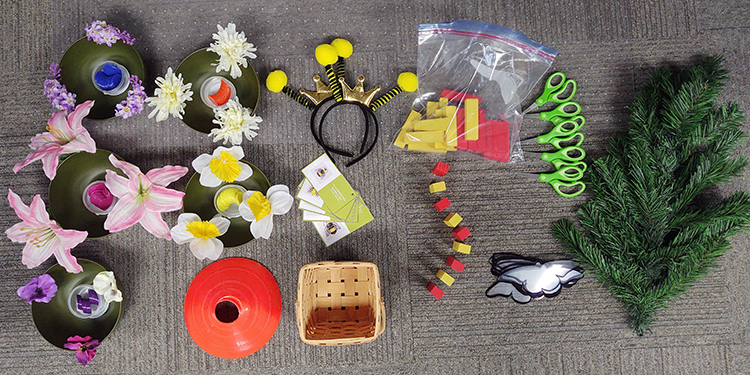 scissors, flowers, bee hats and more pollinator bin contents